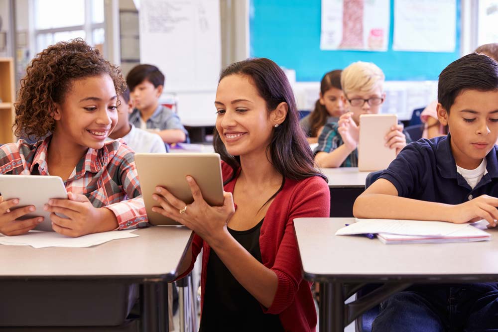 students in a classroom using Raz-Plus