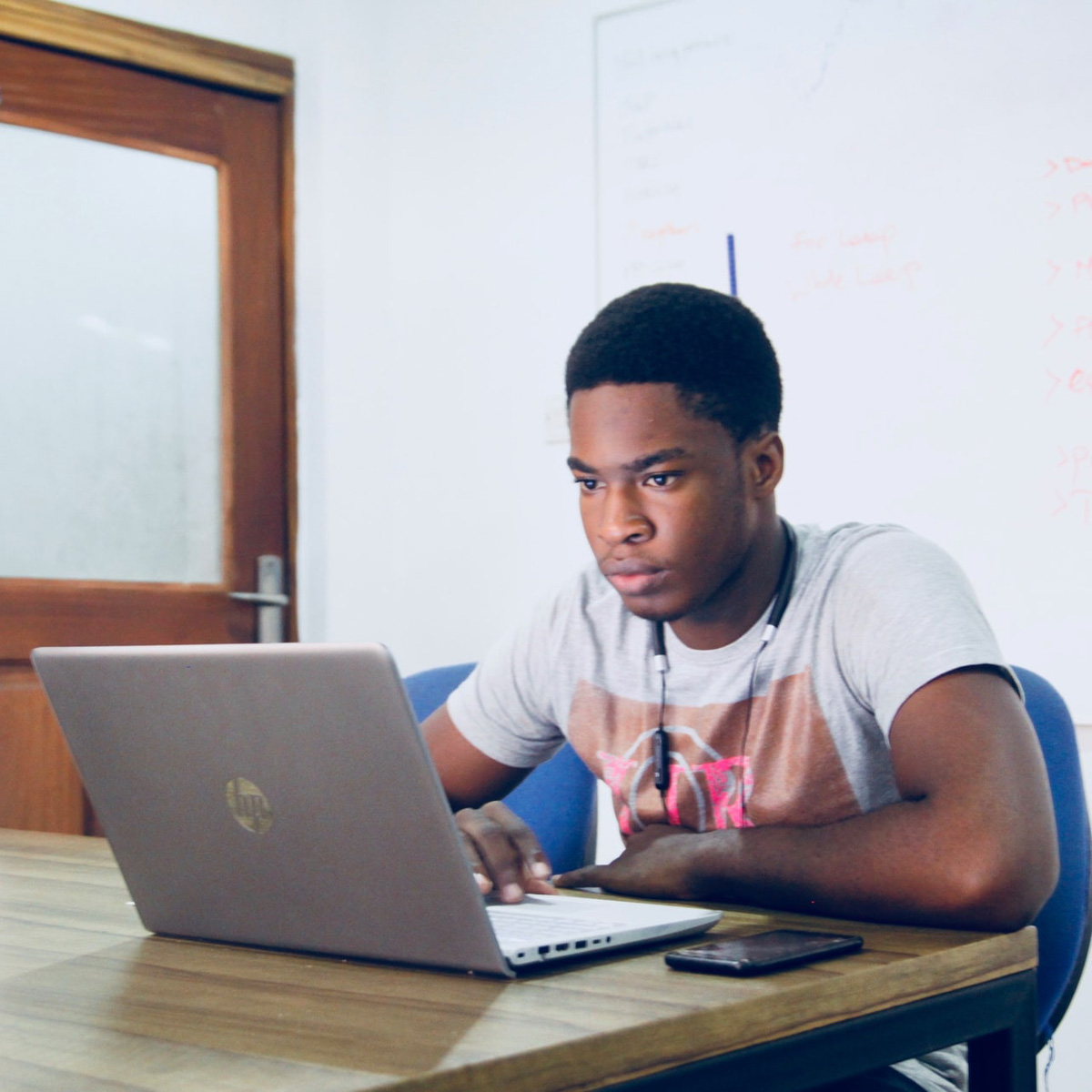 a teenager on a laptop